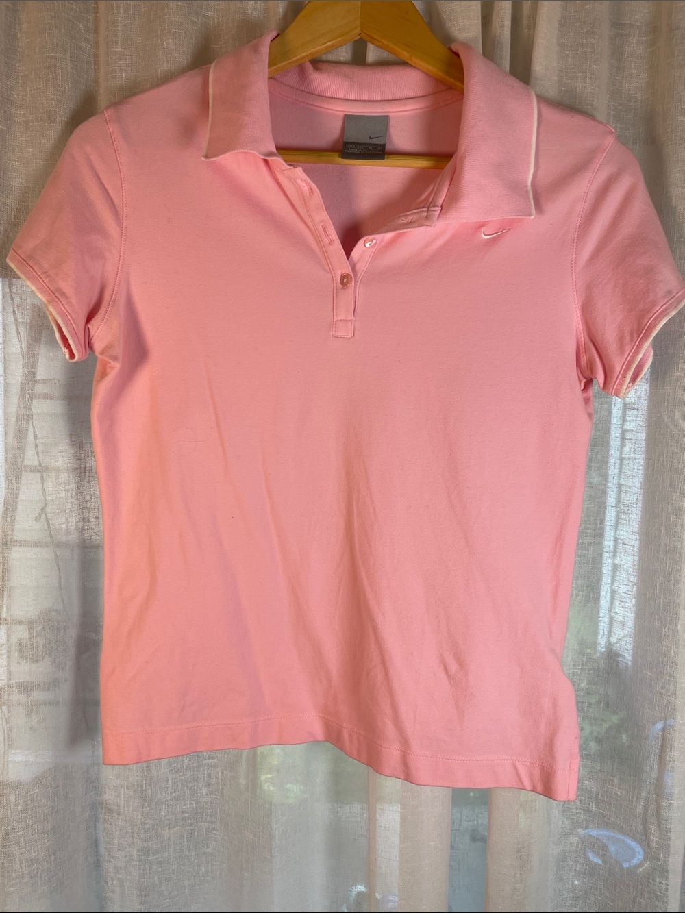 Nike Women's Light Pink Polo Shirt with Subtle Swoosh